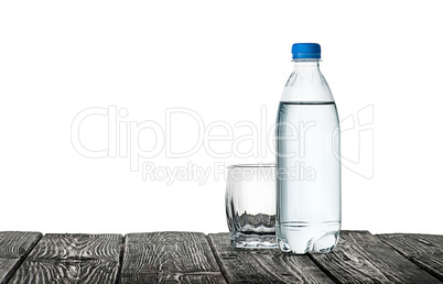 Empty glass and bottle of water