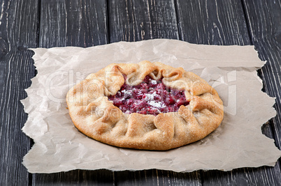 Open pie Galette with red gooseberry