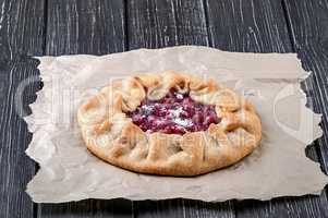 Open pie Galette with red gooseberry