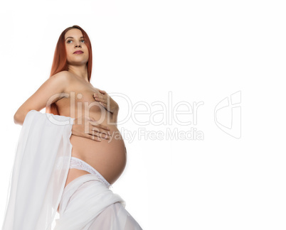 Beautiful nude pregnant woman on a white background. free space for your text
