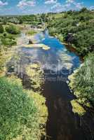 River in Aktovsky canyon, Ukraine. Big rocks in small river and