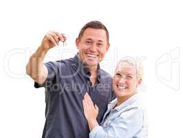 Young Adult Couple Holding New House Keys Isolated On A White Ba
