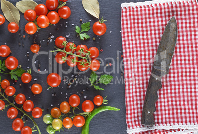 ripe red cherry tomatoes and knife