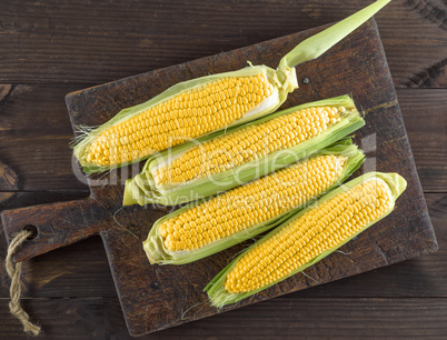 corn cobs on an old brown kitchen board