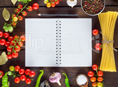 notebook in a line  and ingredients for cooking Italian pasta