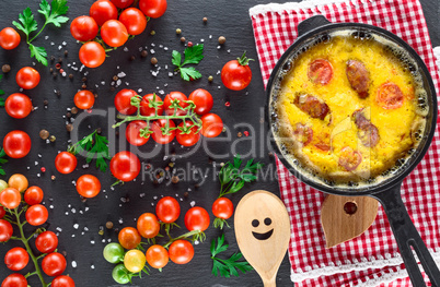 black round frying pan with fried omelette