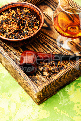 Cognac and pipe with tobacco