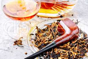 Cognac and pipe with tobacco