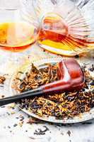 Cognac and pipe with tobacco