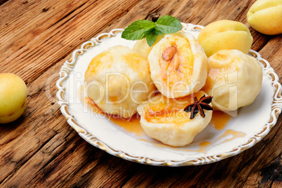 Dumplings with apricot and spicy syrup