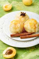Dumplings with apricot and syrup
