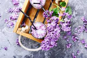 Refreshing drink with lilac and ice