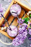 Refreshing drink with lilac and ice