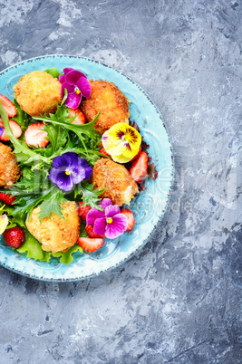 Salad leaves with strawberries,herbs and flowers