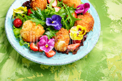 Salad leaves with strawberries,herbs and flowers