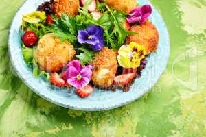 Salad leaves with strawberries,herbs and flowers