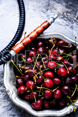 Stylish oriental shisha with cherries
