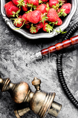 Stylish oriental shisha with strawberry Stylish oriental shisha with strawberry