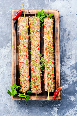 Raw kebabs in skewers