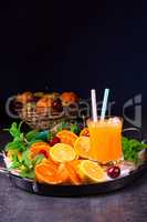 freshly squeezed orange juice with ice in glass