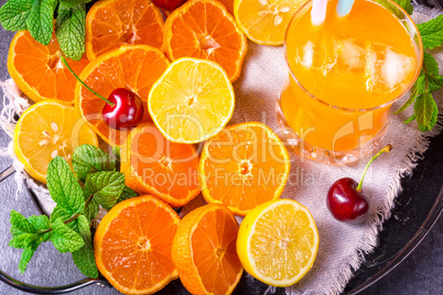 freshly squeezed orange juice with ice in glass