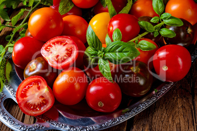 various types of tomatoes served and presented on the silver pla