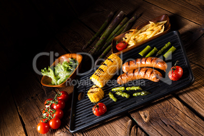 grilled krakauer with french fries and green salad