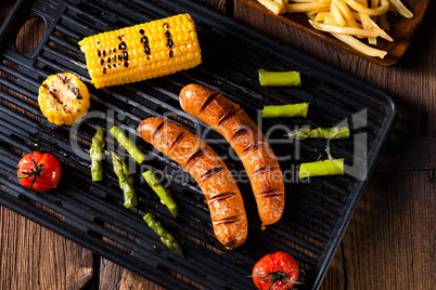 grilled krakauer with french fries and green salad