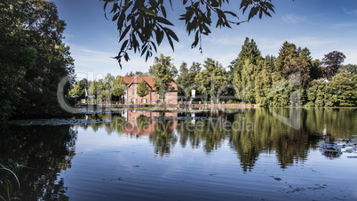 Pond Mühlenteich with the Trittau Water Mill