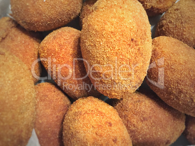 Close up of a group of Italian supplì, traditional fried rice balls