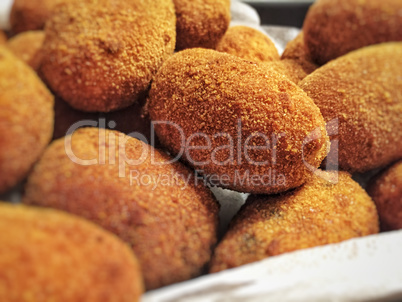 Close up of a group of Italian supplì, traditional fried rice balls
