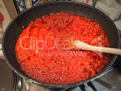 Preparing Italian Bolognese tomato sauce