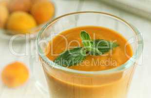 Apricot smoothie in a glass Cup.