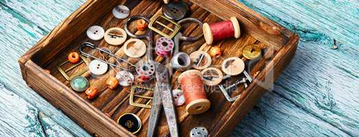 Sewing buttons and spools of thread