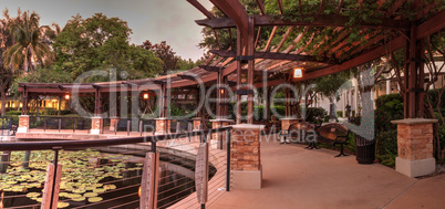 Gazebo overlooking a pond and fountain at sunset at the Garden o