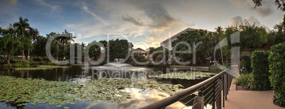 Blue sky over a pond and fountain at the Garden of Hope and Cour