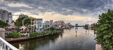 Dark sky over the colorful shops