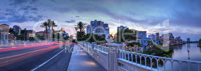 Car Light trails along the road as the Sunset ascends over the c