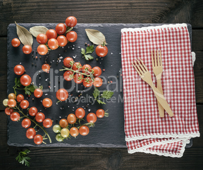 two wooden forks on a red textile kitchen towel