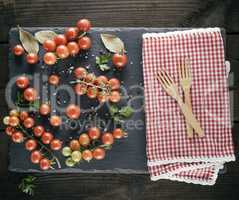 two wooden forks on a red textile kitchen towel