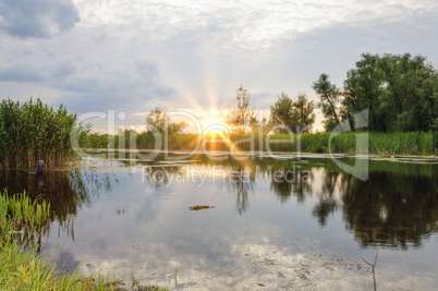 sunset over the Dnieper river in the summer evening