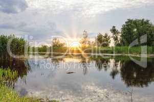 sunset over the Dnieper river in the summer evening