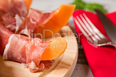Close up of prosciutto and melon Italian appetizer