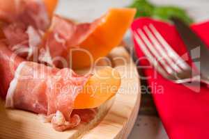 Close up of prosciutto and melon Italian appetizer