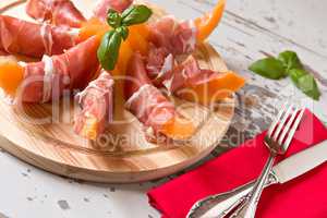 Italian cutting board with prosciutto and melon
