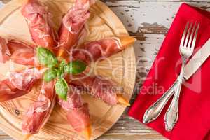Italian prosciutto and melon with basil