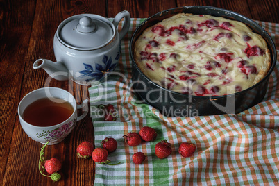 Breakfast with strawberry pie, black tea and berries