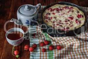 Breakfast with strawberry pie, black tea and berries