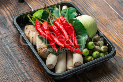 Set for Thai cooking in pallet on wooden table