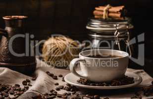 Coffee cup with igredients, beans and equipment